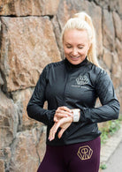 Wind Jacket  by Power Woman in the hand-printed Gold Tiger Collection is a light-weight jacket that can easily be folded into your bag or pocket. Snug fit with 4-way stretch material perfect for running, skiing or biking.